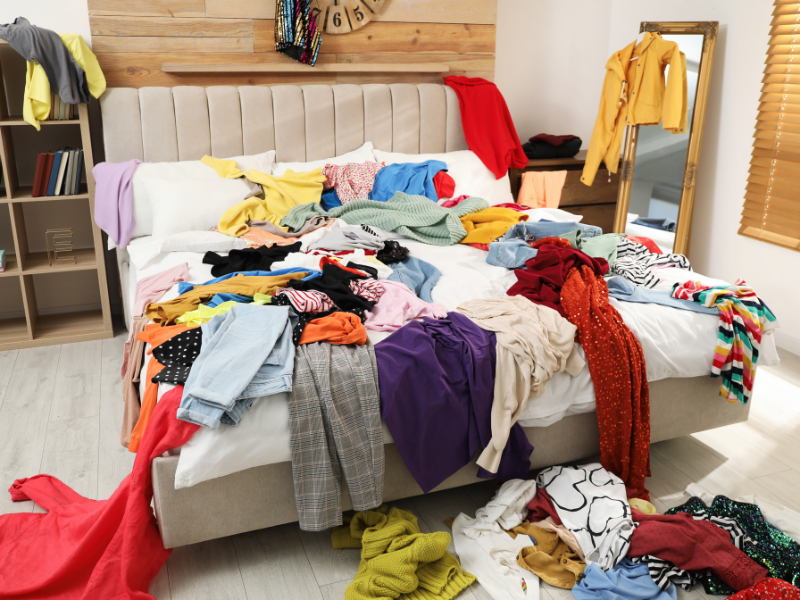 a bed full of messy clothes